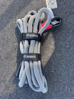 Saber offroad 12K kinetic recovery rope ready to use laying on the road 