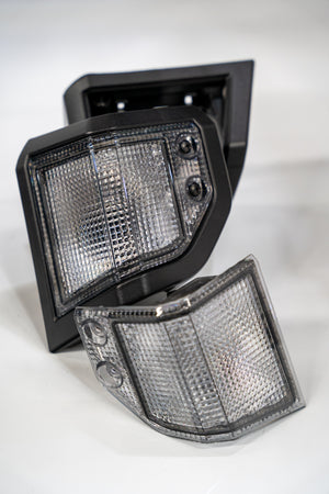 Budget friendly clear front indicator housing set for Toyota landcruiser 70 series.