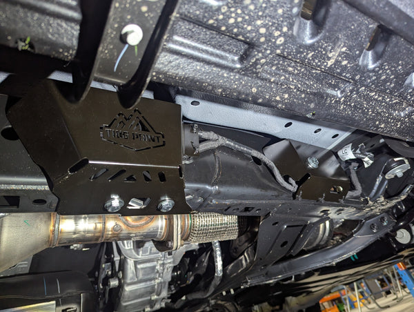 view of trig point wiring and ecu protection plates installed in black