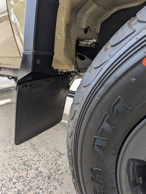 High clearance facelift mudflap bracket installed 