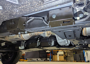 Undercarriage view of a ford super duty showing black metal underbody protection, wiring guards installed on car.