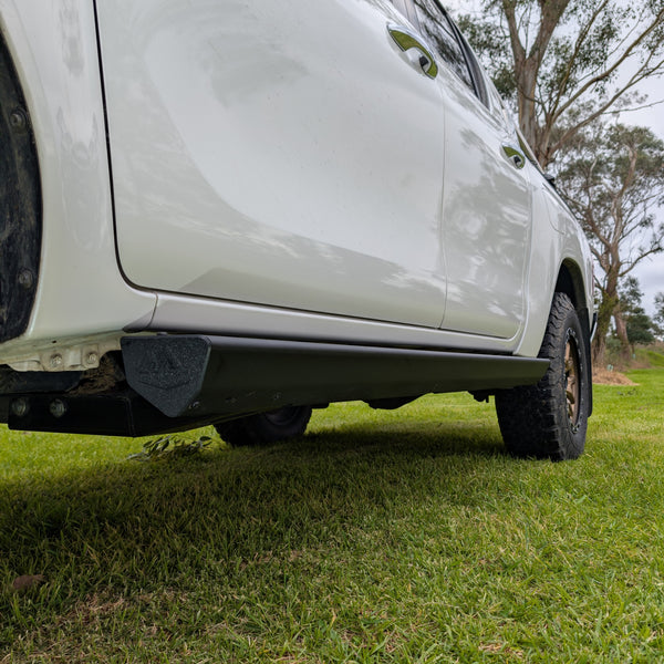 black powder coated side step sliders integrated into Toyota hilux n80 n90