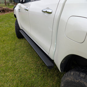 black Trig Point hilux sliders installed on 4wd off road 