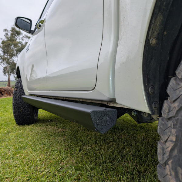 low profile side view of installed n80 hilux and n90 Toyota side steps