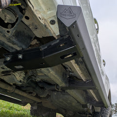 Trig Point n80 n90 hilux side steps installed on muddy white Toyota 