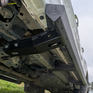 Trig Point n80 n90 hilux side steps installed on muddy white Toyota 